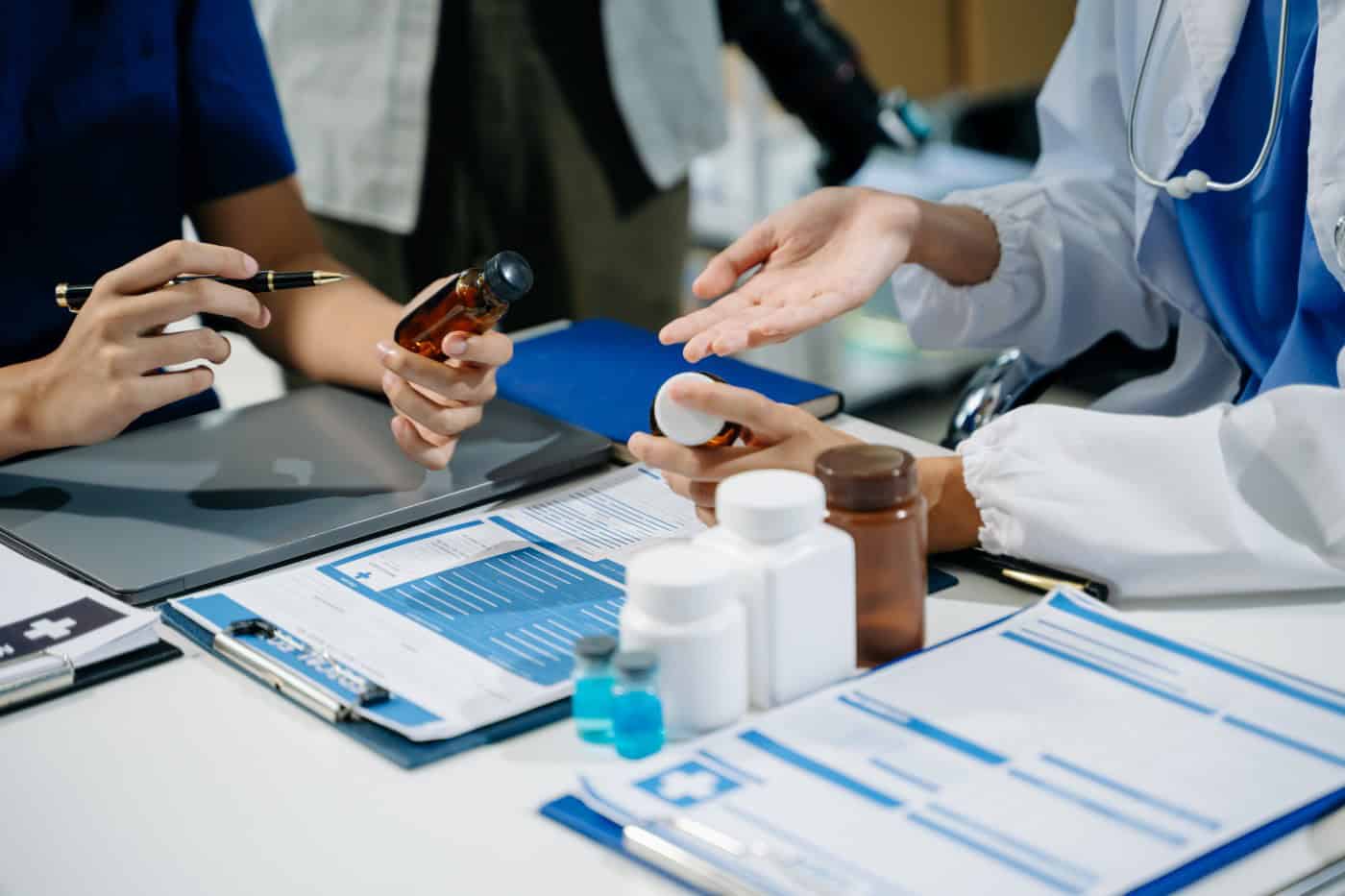 Medical professionals discussing personalized medication options and prescription clinical data