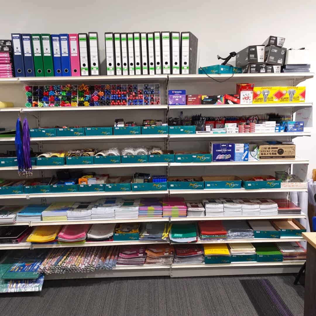 Bookstore shelves with stationery and academic supplies