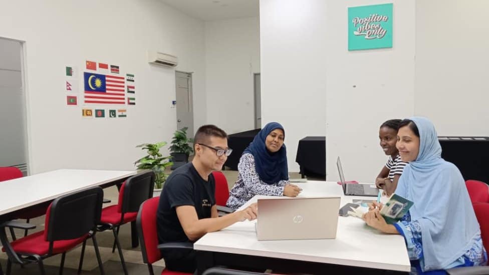 Students working together at a study table