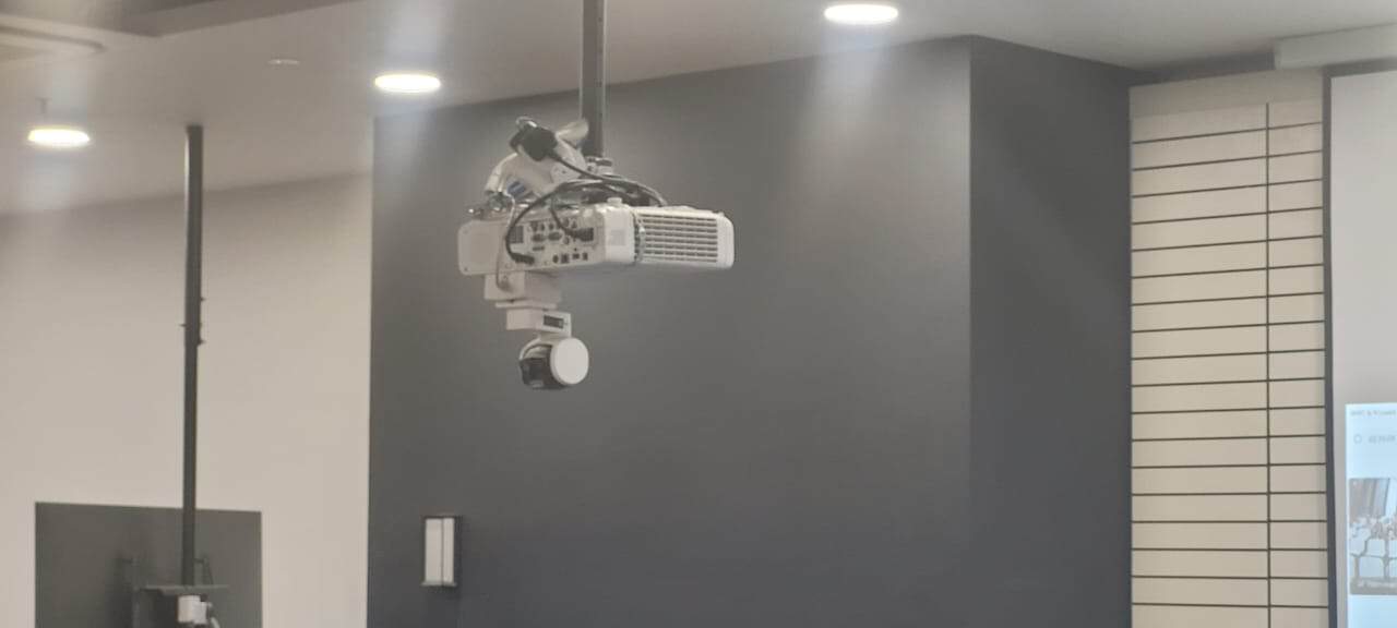 Auto-tracking camera in a hybrid lecture hall