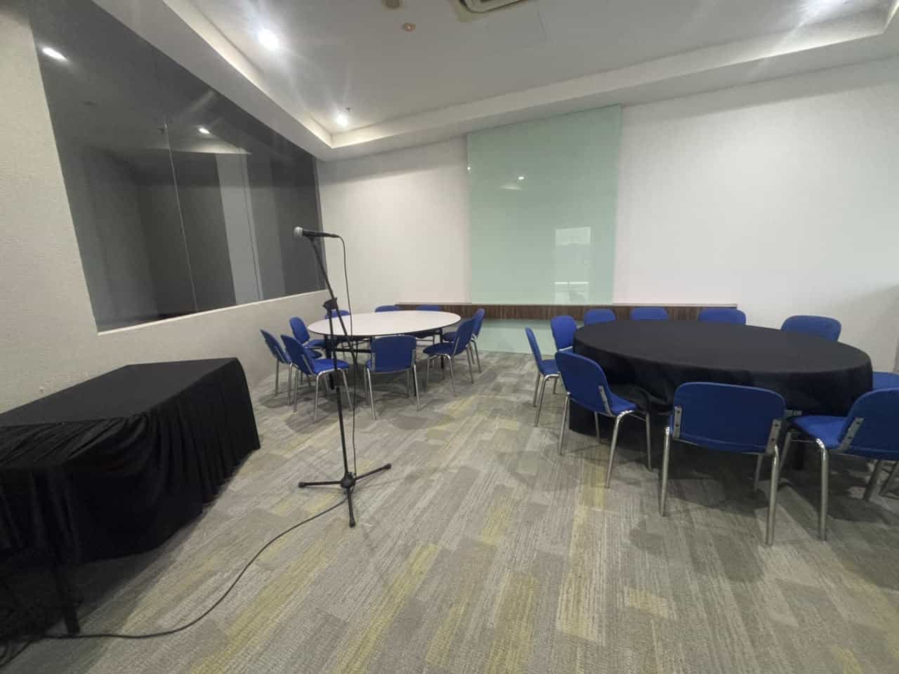 Multifaith Room with tables and blue chairs
