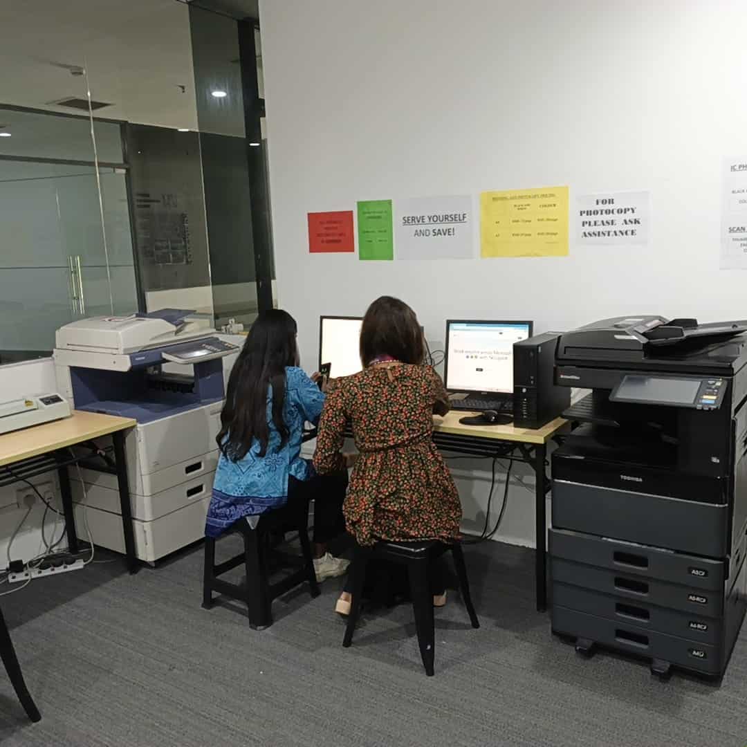 Students using the campus printing services